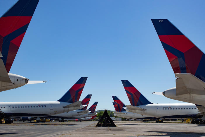 Dozens of Delta jets have been parked on the tarmac of the Birmingham-Shuttlesworth International Airport since last spring. The airline reported $5.4 billion in third quarter losses on Tuesday.