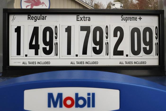 Gasoline prices are posted at a Mobil gas station in Candia, N.H., on April 30. The coronavirus pandemic has renewed a critical debate about just when global oil demand will peak.