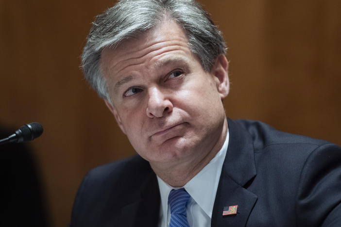 FBI Director Christopher Wray testifies before the Senate's Homeland Security Committee on Sept. 24. Wray and other national security officials say they've taken extensive safeguards to protect this year's election. This message is often in sharp contrast with President Trump, who has repeatedly questioned the integrity of the vote.