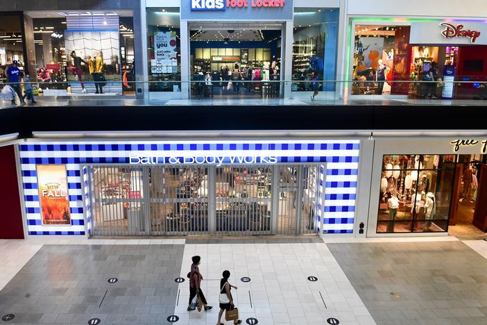 Shoppers stroll through the newly reopened Westfield Santa Anita mall in Arcadia, Calif., on Oct. 7.