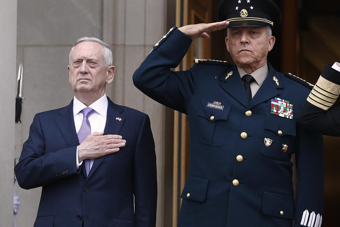 Former Mexican Defense Secretary Gen. Salvador Cienfuegos, right, with former U.S. Defense Secretary Jim Mattis at the Pentagon in 2017. Cienfuegos was arrested on a DEA warrant at Los Angeles International Airport Thursday.