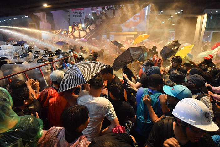 Riot police use water cannons to disperse pro-democracy protesters during an anti-government rally in Bangkok on Friday.