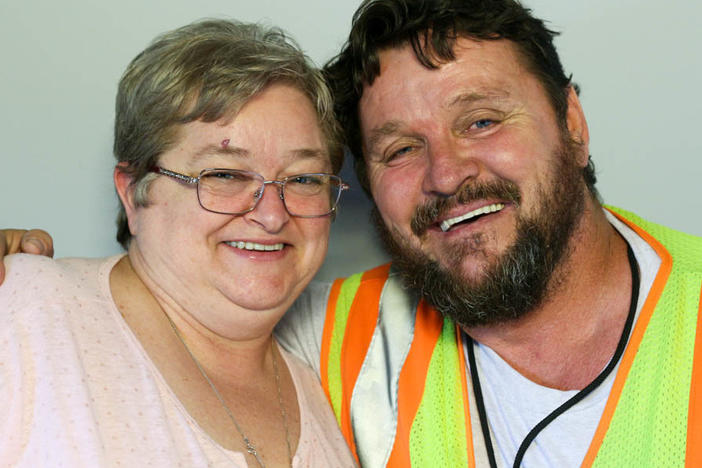 Brian McConnell, right, spoke with his wife, Nora, during a StoryCorps interview in Atlanta in 2016, about his "calling": working with the Delta Honor Guard to greet the remains of a military service members killed in active duty.