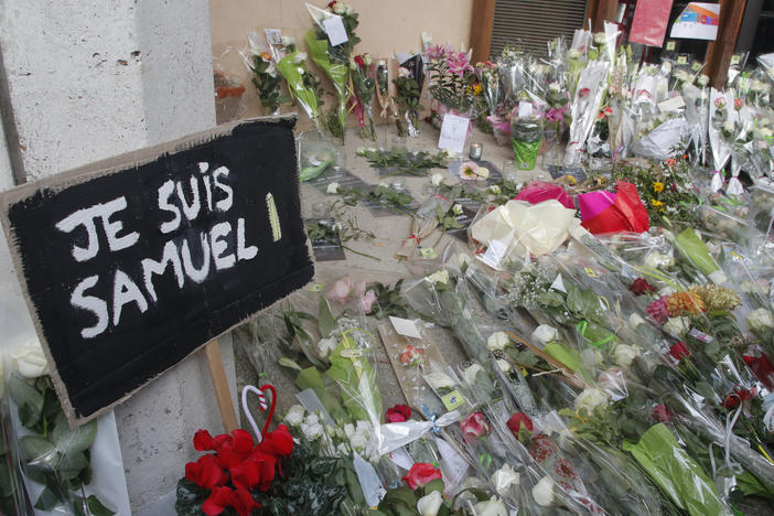 Authorities in France say they've detained nine people in connection with the decapitation of a history teacher in a Paris suburb on Friday. The teacher had shown caricatures of the Prophet Muhammad to his class, authorities said.