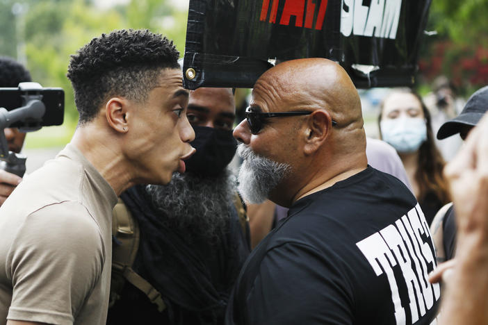 Republican National Convention protesters and counterprotesters clash at the Resist RNC 2020 protest rally at Marshall Park on Aug. 24 in Charlotte, N.C.