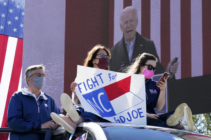 Supporters listen as Democratic presidential nominee Joe Biden speaks during a drive-in campaign event at Riverside High School in Durham, N.C., on Sunday.