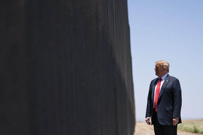President Trump tours a section of the border wall in San Luis, Ariz., on June 23. The Supreme Court is agreeing to review a Trump administration policy that makes asylum-seekers wait in Mexico for U.S. court hearings.