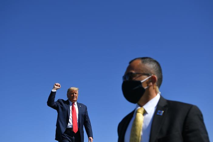 President Trump arrives to speak during a rally Monday at Prescott Regional Airport in Prescott, Ariz., one of many stops he has made recently in potential swing states.