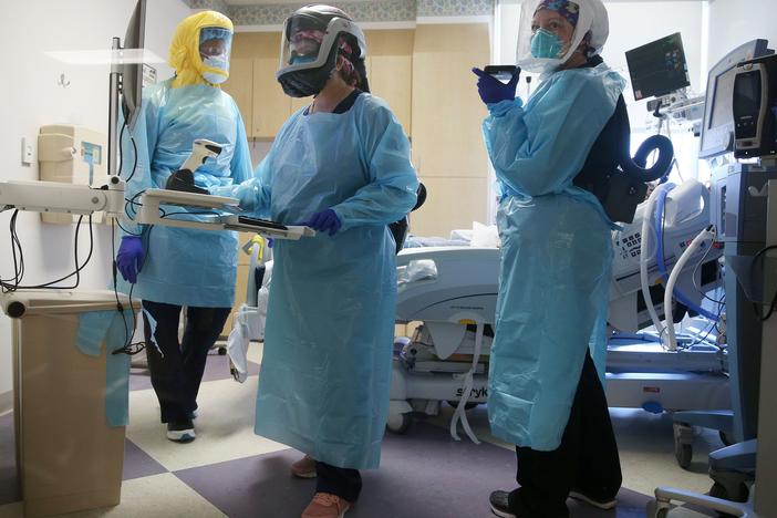 COVID-19 mortality rates are going down, according to studies of two large hospital systems, partly thanks to improvements in treatment. Here, clinicians care for a patient in July at an El Centro, Calif., hospital.