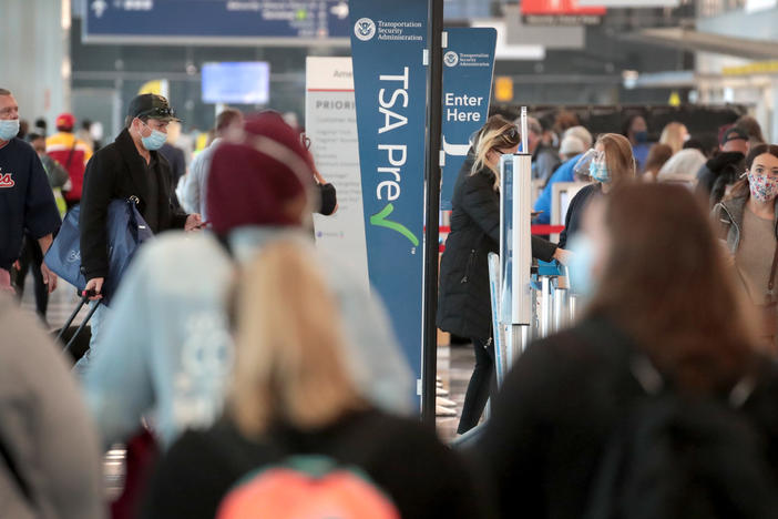 Passengers enter a checkpoint at O'Hare International Airport on Monday. The TSA reports it screened over 1 million passengers on Sunday, the highest number since the coronavirus crisis began.