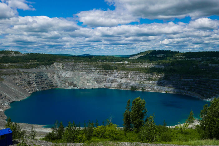 A photo taken in July shows what's left of the Jeffrey asbestos mine in Asbestos, Quebec. The town has voted to change its name to Val-des-Sources.