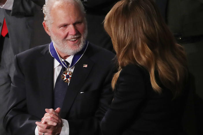 Rush Limbaugh says he intends to keep putting on his radio show despite his stage 4 lung cancer that he says has recently progressed. Here, he's seen reacting as first lady Melania Trump gives him the Presidential Medal of Freedom during the State of the Union address in February.