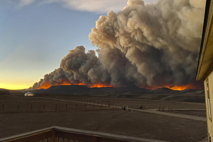 People near Rocky Mountain National Park have evacuated and the park was closed after one of several fires burning in northern Colorado exploded late Wednesday. A resident took this photo from her home north of Granby, Colo., on Wednesday.