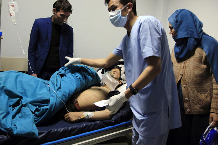 Patients are treated at a hospital after a suicide attack in Kabul, Afghanistan, on Saturday. Dozens were injured.
