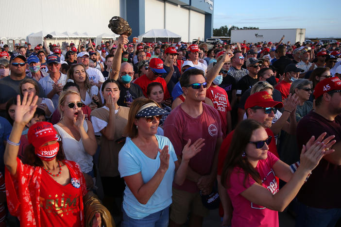 Supporters cheer during a Trump rally in Pensacola, Fla. Rallies and in-person events have been a key part of the campaign strategy, even in the midst of the pandemic.