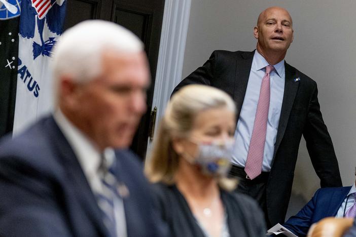 Marc Short, the chief of staff to Vice President Pence, listens to Pence speak during a White House event in September. Short tested positive for the coronavirus on Saturday.
