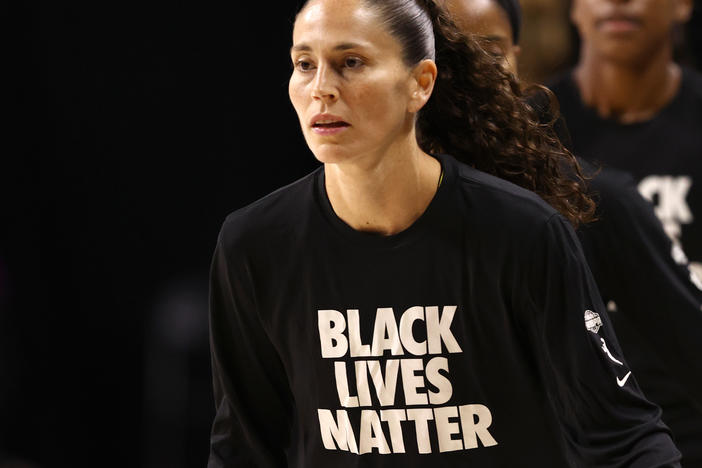 Sue Bird of the Seattle Storm, wears "Black Lives Matter" warm-up shirts before a game in July.
