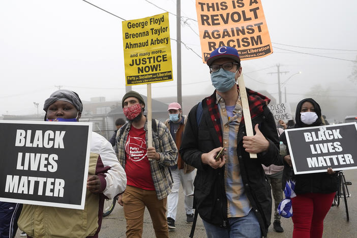 People march during a protest rally Thursday in Waukegan, Ill., for Marcellis Stinnette, whom a police officer killed last week.