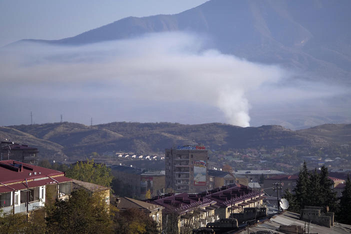 Smoke rises after shelling by Azerbaijan's artillery in Stepanakert, Nagorno-Karabakh, on Saturday.