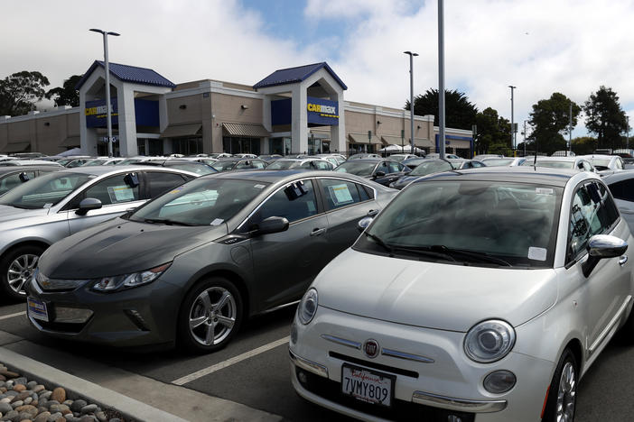 Used vehicles are parked on the sales lot at a CarMax store on Sept. 24 in Colma, Calif. CarMax reported a surge in earnings after used-car prices climbed steadily — and surprisingly — for months.