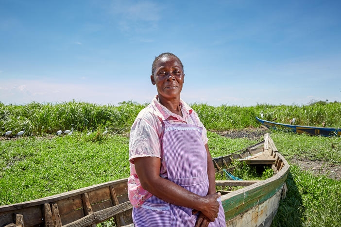 Alice Amonde sits on a boat on the village of Nduru Beach, Kenya. She is part of the group of women who have fought against the practice of transactional sex that was part of the fishing business. This photograph was taken in November 2019. This spring, flooding from Lake Victoria devastated the village.