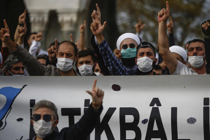 Demonstrators chant slogans during an anti-France protest in Istanbul on Sunday, as tensions rise between the two countries.
