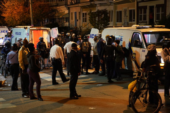 Philadelphia police issue a final warning for curfew violation to protesters at 55th and Pine Streets in West Philadelphia, on Wednesday, the third straight night of protesting and unrest after the fatal shooting of Walter Wallace Jr. by police.