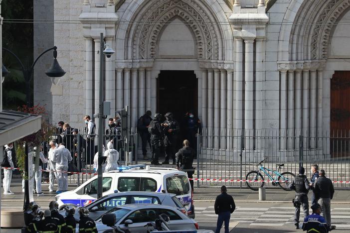 Members of a French elite tactical police unit search the Notre Dame Basilica in Nice after a knife attack that killed three people and injured several others on Thursday.