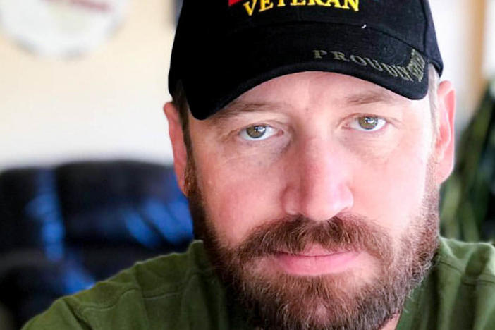 "I think in a lot of ways, we survived that deployment in Iraq by sharing humor with each other," said former Army Spc. Garett Reppenhagen, seen at home in Colorado Springs, Colo.