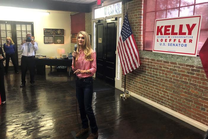 Republican Sen. Kelly Loeffler campaigns in Buford, Ga., telling supporters she's 100% with President Trump.