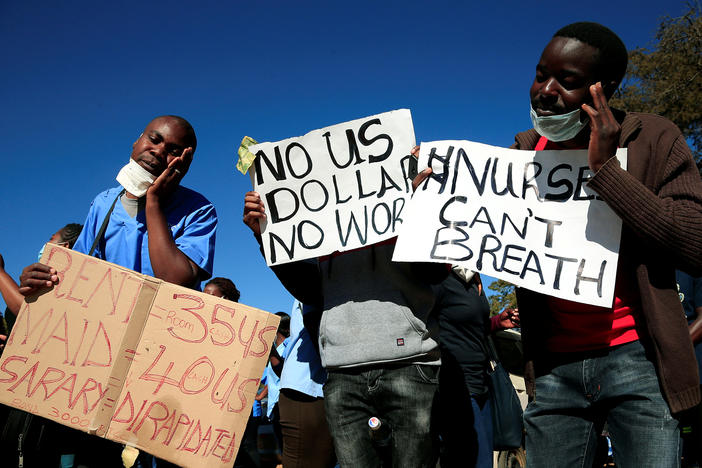 Health workers protest against economic hardship and poor working conditions during the COVID-19 outbreak in Harare, Zimbabwe.