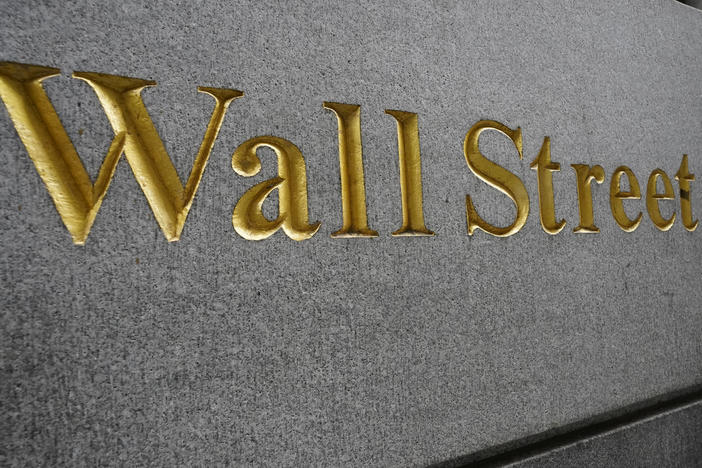 "Wall Street" is etched on a building across the street from the New York Stock Exchange in September. Stocks are rallying as voters head to the polls Tuesday.