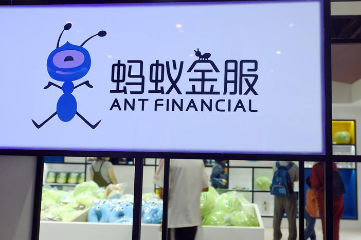 People visit a showroom of the mobile payment powerhouse, Ant Financial, in China in 2018. Ant Financial, a spinoff from the Alibaba Group, was set to raise $37 billion in an IPO that regulators abruptly halted.