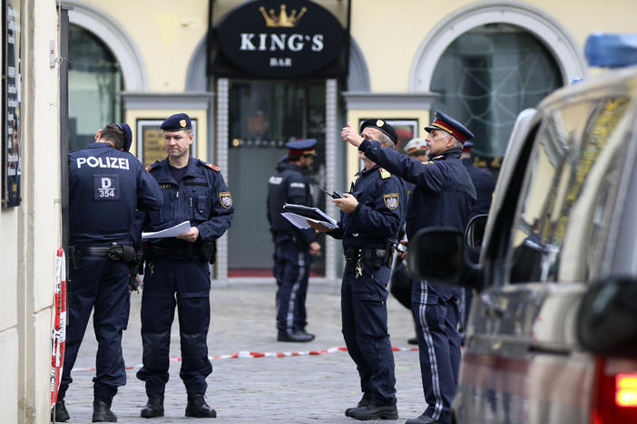Police officers investigate the scene in Vienna on Tuesday, the day after at least one gunman went on a shooting spree in the city center before he was shot and killed by police.