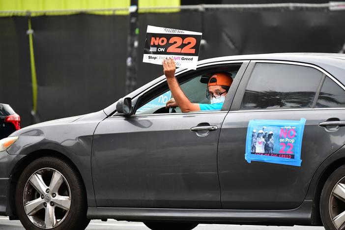 A California ballot measure over whether Uber and Lyft should treat their drivers as employees divided gig workers but was approved by voters.