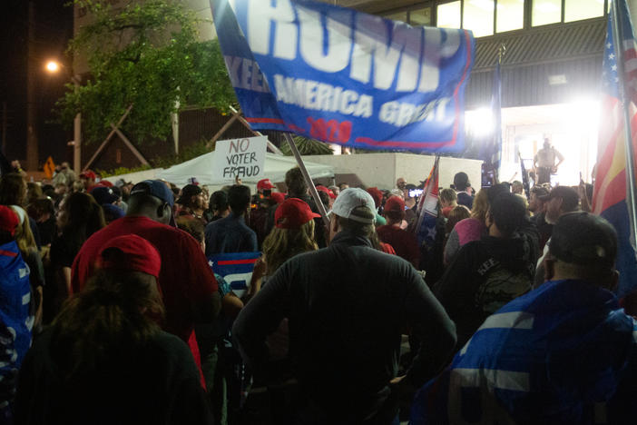 Supporters of President Trump gather to protest election results at the Maricopa County Elections Department office on Nov. 4 in Phoenix.