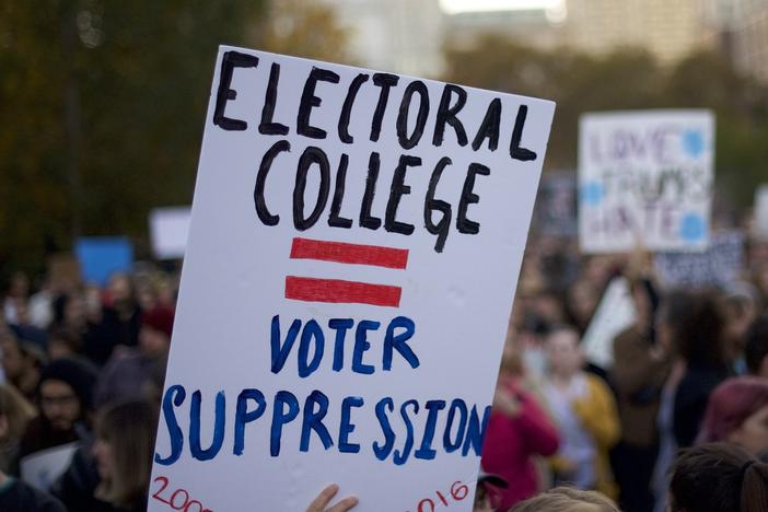 Protesters demonstrate four years ago against Donald Trump, then the president-elect, outside Independence Hall in Philadelphia. Trump won the Electoral College but lost the popular vote by nearly 3 million votes.