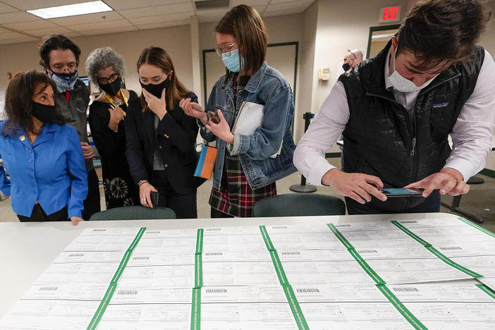 Democratic and Republican canvas observers inspect Lehigh County provisional ballots as vote counting in the general election continued on Friday.