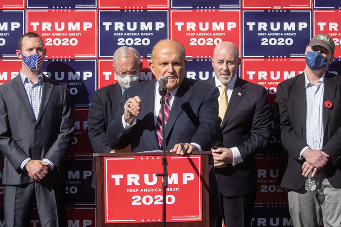 Attorney for the president Rudy Giuliani speaks to the media at a press conference held in the back parking lot of a landscaping company over the weekend in Philadelphia.