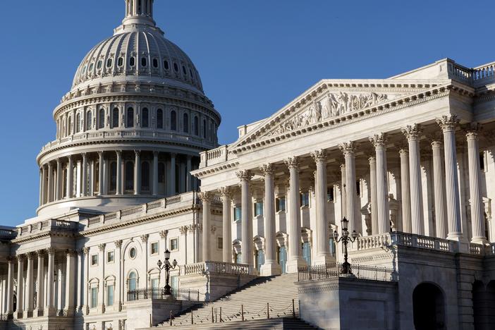 The Senate side of the Capitol is seen in Washington, D.C., early Monday. Experts say President-elect Joe Biden's ability to reshape the U.S. immigration system will be sharply limited if Republicans retain control of the Senate.
