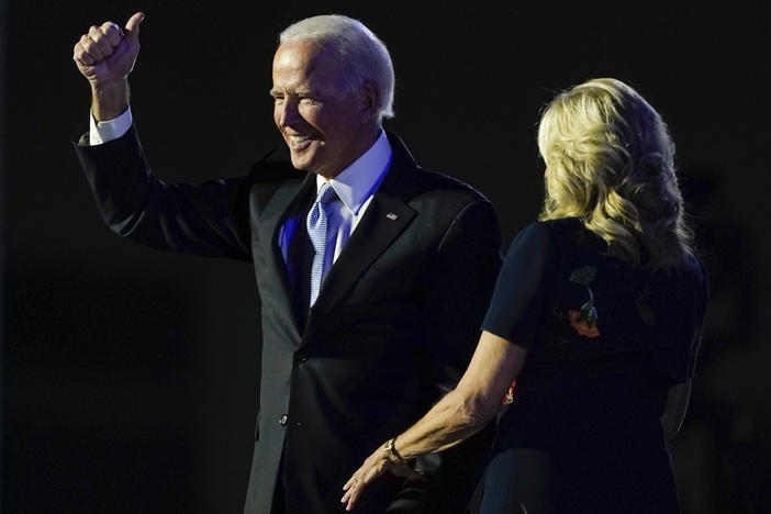 President-elect Joe Biden stands on stage with his wife, Jill Biden, on Saturday in Wilmington, Del. The incoming first lady is an English professor at Northern Virginia Community College.
