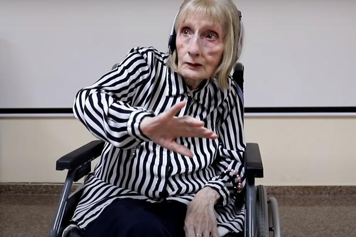 A former ballerina named Marta C. González, dancing to the music of <em>Swan Lake</em><em></em> in a video still from YouTube.