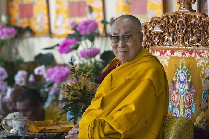 The Dalai Lama, Tibet's spiritual leader, sits on his ceremonial chair as he presides over the inauguration of the Namgyal Monastery School in Dharamshala, India, on Nov. 2, 2017.