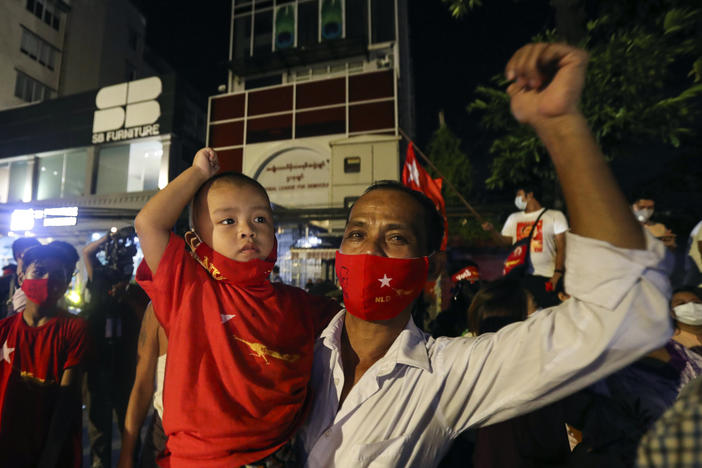 Supporters gather in front of Aung San Suu Kyi's National League for Democracy headquarters on Sunday, in Yangon, Myanmar.