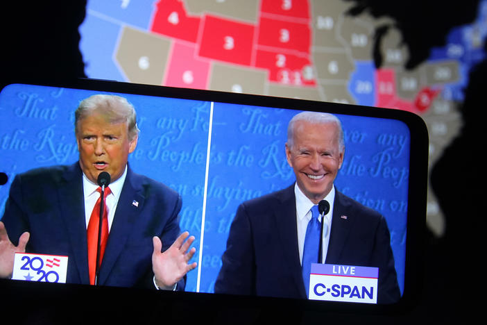 Some major final steps for the 2020 census are set to take place during the transition from President Trump to President-elect Joe Biden, who both appear above on a smartphone displaying the final presidential debate in October.