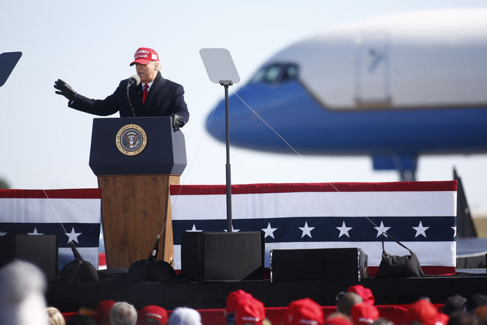 President Trump delivers remarks during a campaign rally at Fayetteville Regional Airport in North Carolina on the night before Election Day.