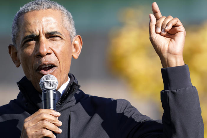 Former President Barack Obama speaks at a rally for Joe Biden in Flint, Mich. on Oct. 31. In an interview with NPR, Obama said Trump was "denying reality" by refusing to concede the election to Biden.