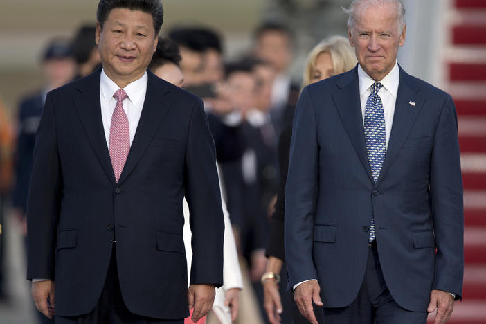 Chinese President Xi Jinping and then-Vice President Joe Biden in 2015 at an arrival ceremony at Joint Base Andrews. China recognized Biden's election as president Friday.