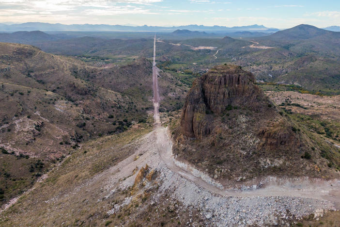 In the Guadalupe Canyon in southeastern Arizona, work crews are dynamiting mountainsides and bulldozing access roads in this stunning landscape to make way for the border wall. Mexico is on the left.