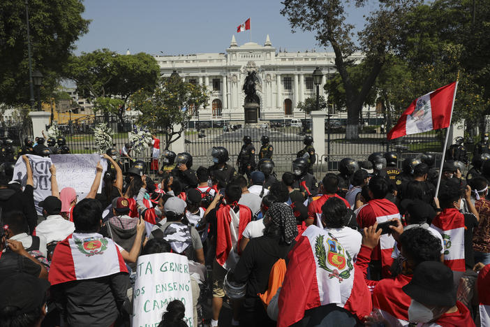 Protesters gather outside Congress in Lima, Peru, after interim President Manuel Merino announced his resignation following massive protests unleashed when lawmakers ousted President Martín Vizcarra.